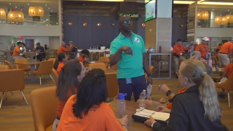 Miami Dade College professor finds his passion with side job at Hard Rock Stadium — CBS Miami, Garland Arts news